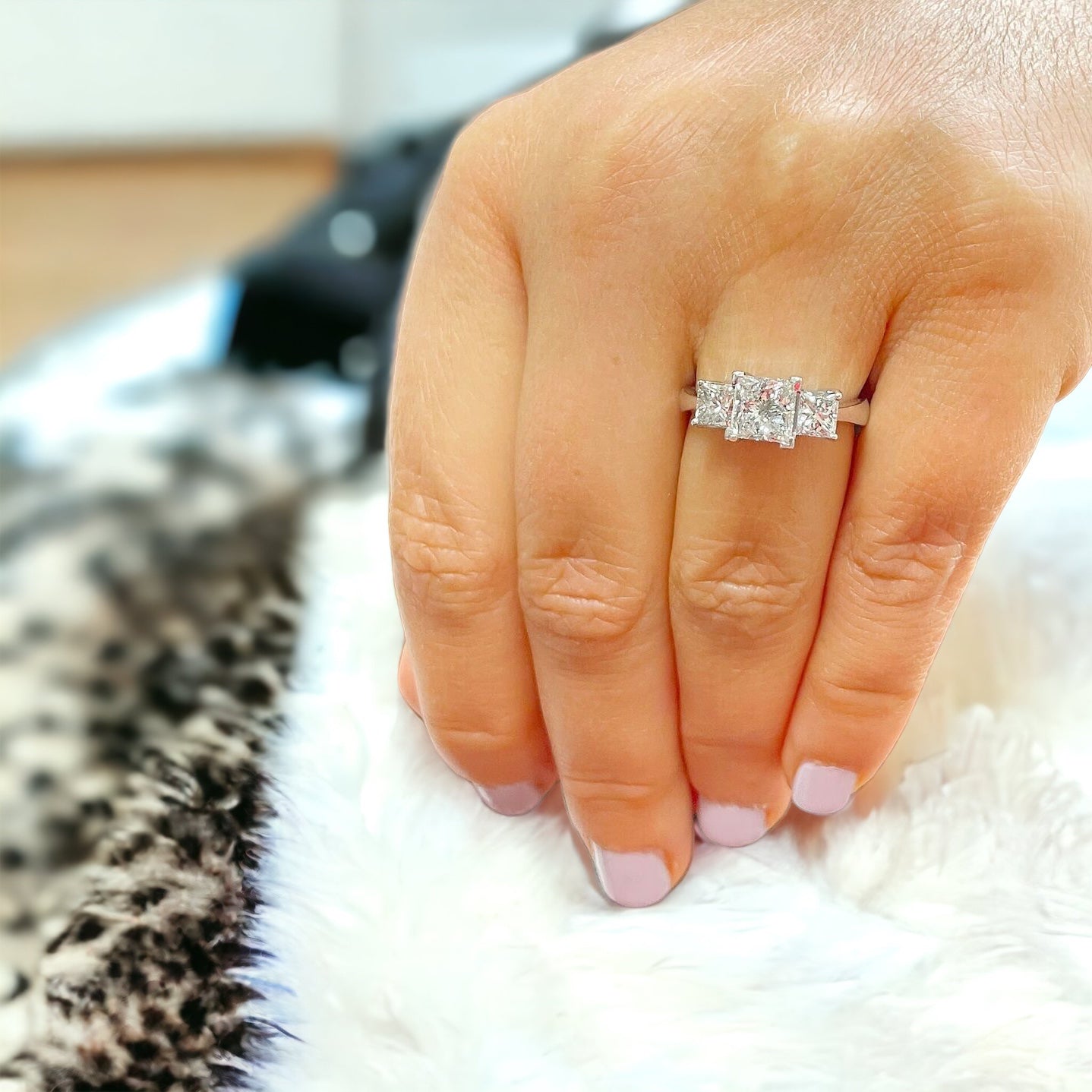 Three stone princess cut moissanite engagement ring in yellow, white, and rose gold or platinum, designed in New Zealand by Nura Lab.
