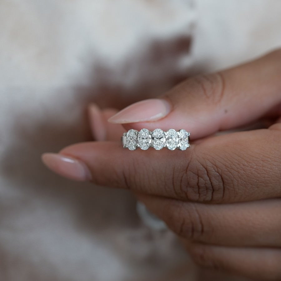 Nura Lab 3ct oval five stone anniversary ring on hand — 14K gold