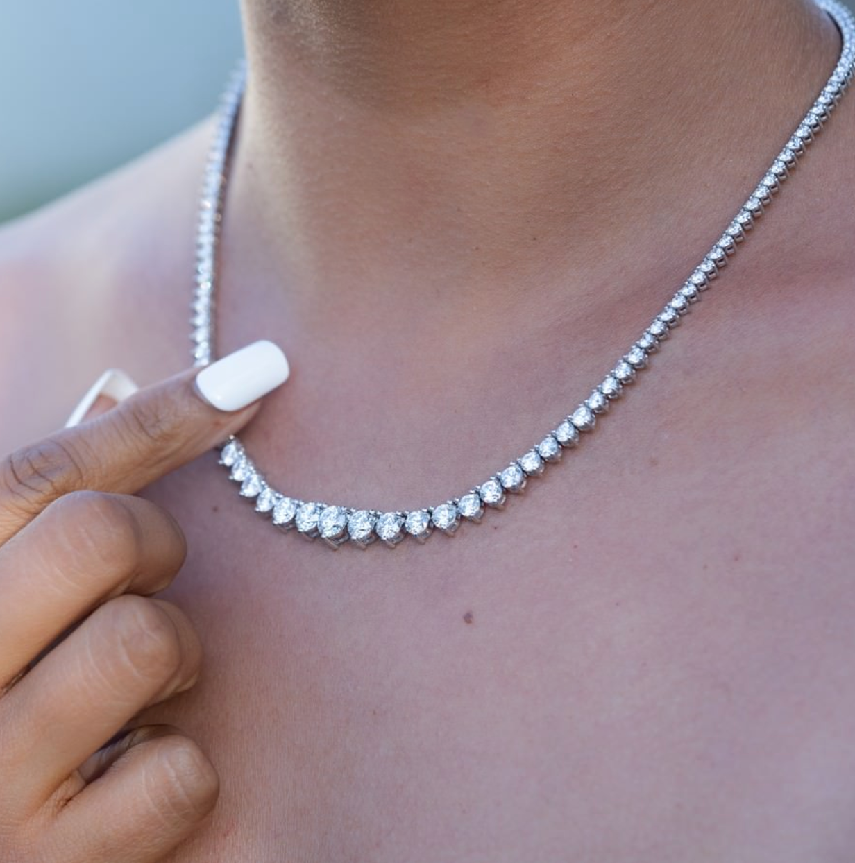 Close-up of 3-prong setting with lab-grown round diamonds—Riviera necklace