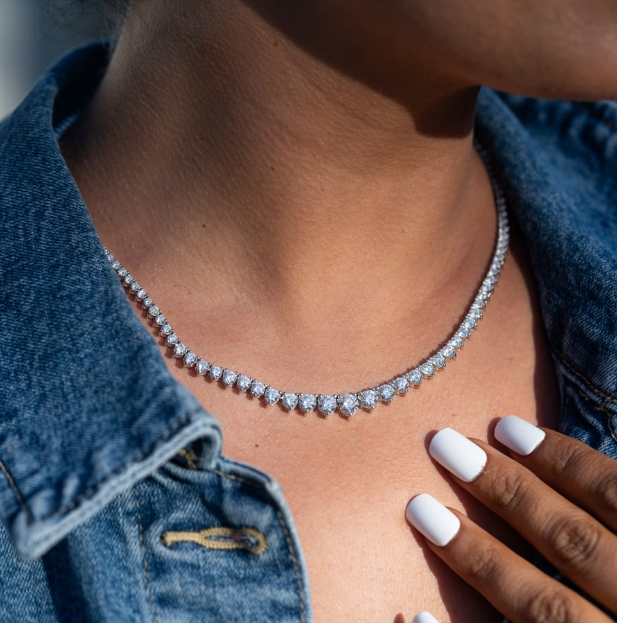 Lab-grown diamond Riviera necklace in 14K white gold styled on model’s neckline