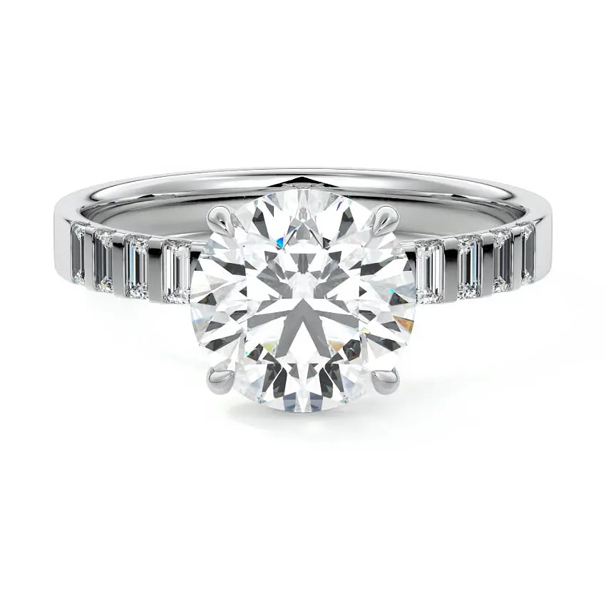 Round cut engagement ring with emerald cut side stones in 18K white gold by Nura Lab