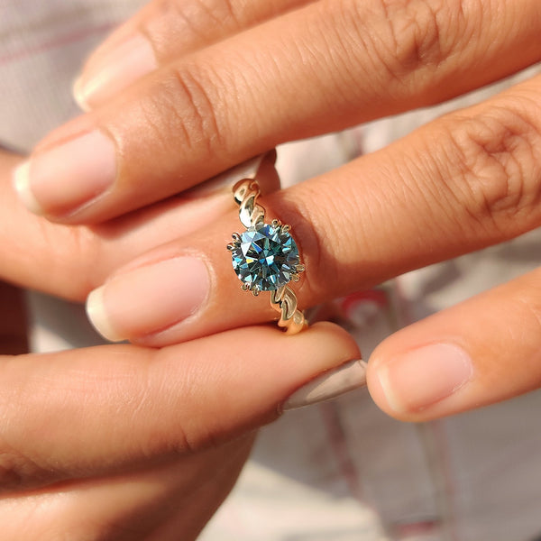 Genevieve Claire - Cyan Blue Round Cut Hidden Halo Ring With Twisted Rope Band
