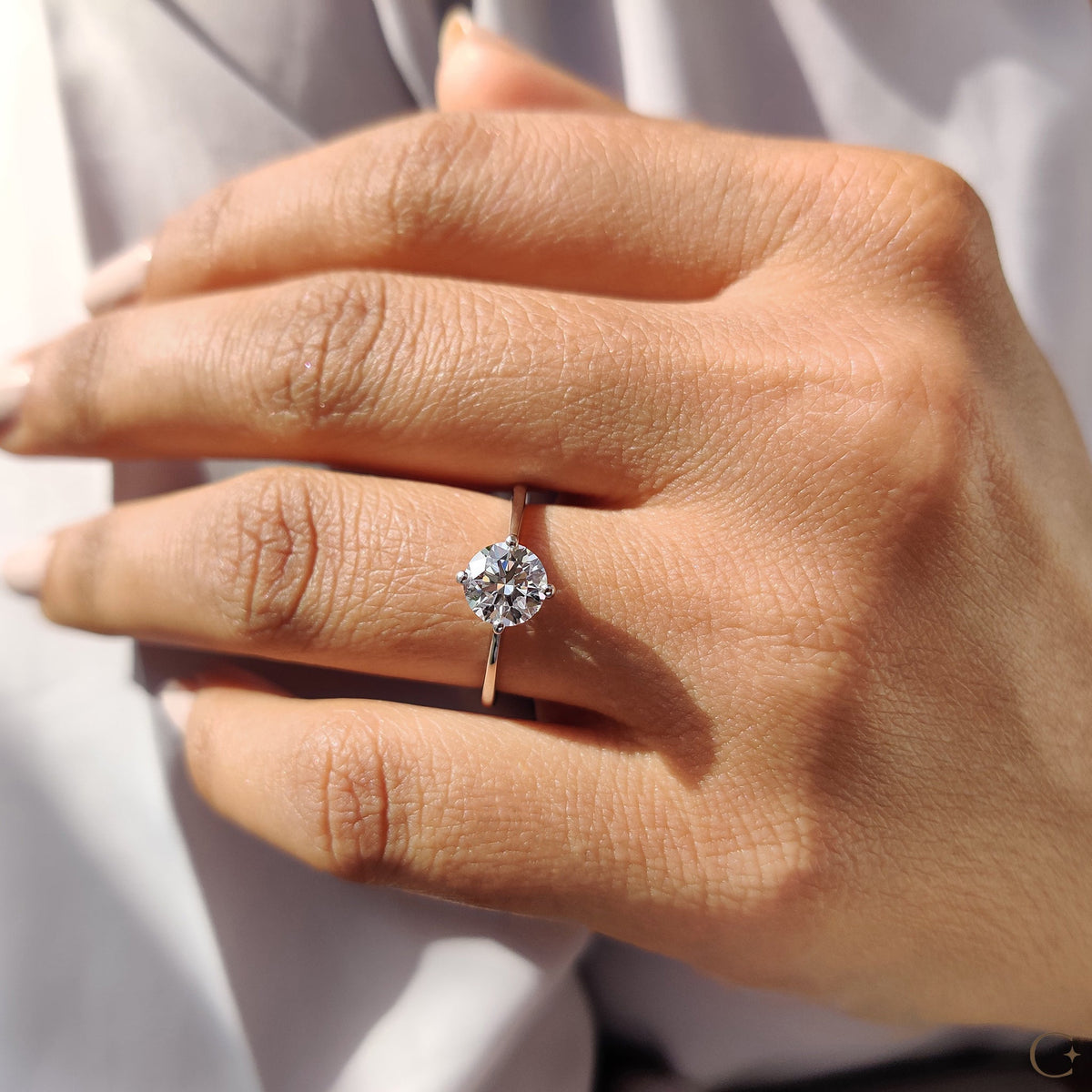 Clarissa Belle - Round Solitaire Engagement Ring With Tapered Shank Design