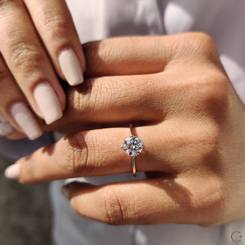 Clarissa Belle - Round Solitaire Engagement Ring With Tapered Shank Design