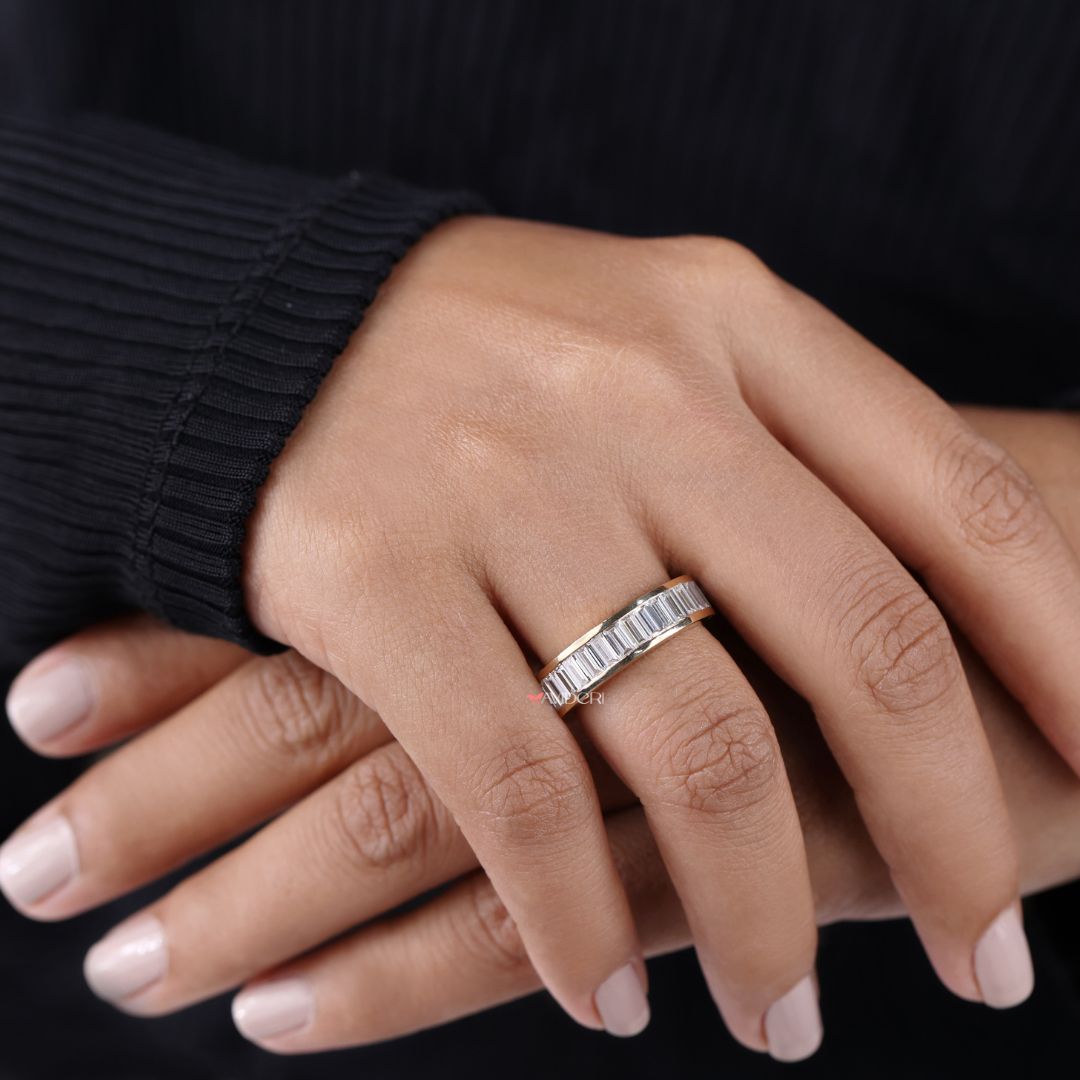 Eternity wedding band sparkles all around with continuous moissanite brilliance.
