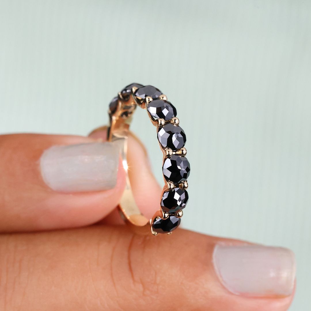 Black round rose cut moissanite wedding band shines with bold beauty.
