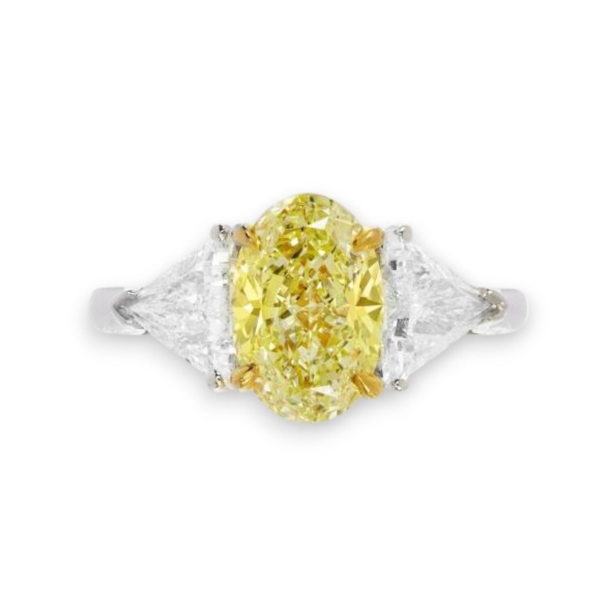 Three stone oval cut yellow diamond trilogy engagement ring in 18K gold