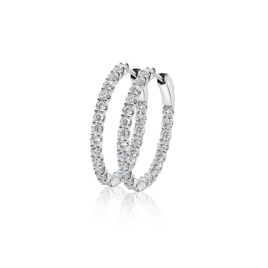 Close-up pavé setting F-G SI lab-grown diamonds on 14K white gold huggies