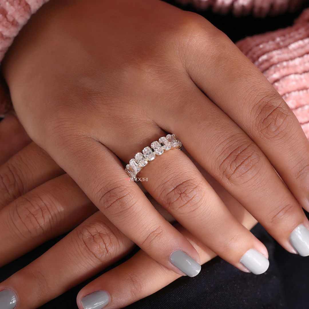 The Shared Prong band enhances brilliance with closely set stones.