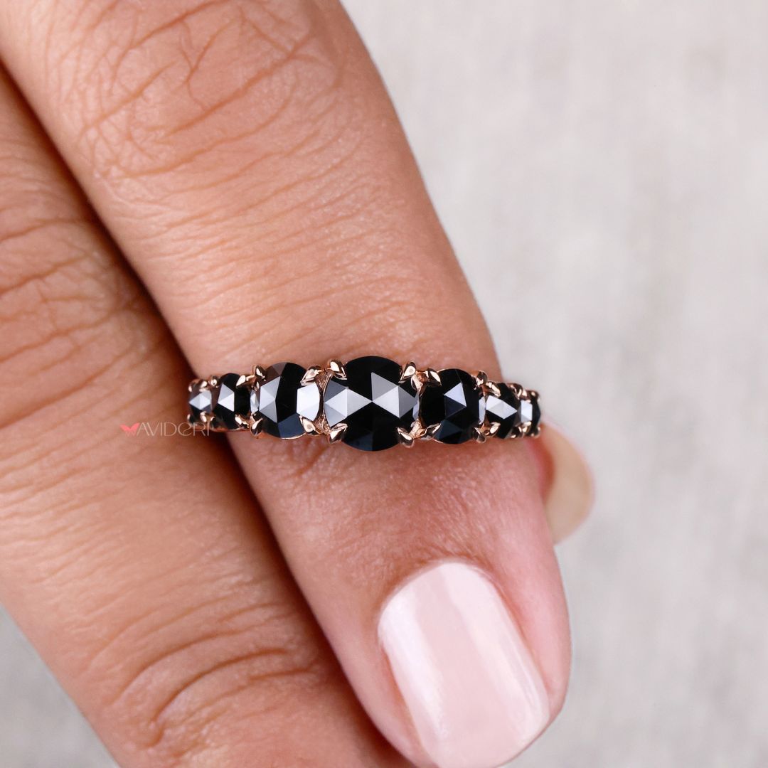 Rose gold wedding band featuring round cut diamonds for a timeless look.
