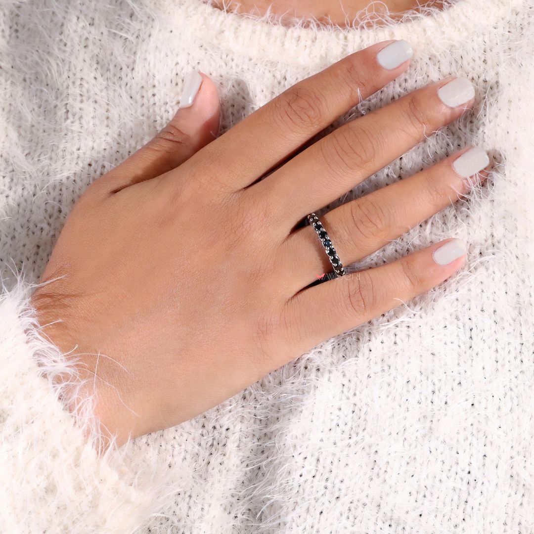 Handmade band with moissanite stones for a unique eternity design.
