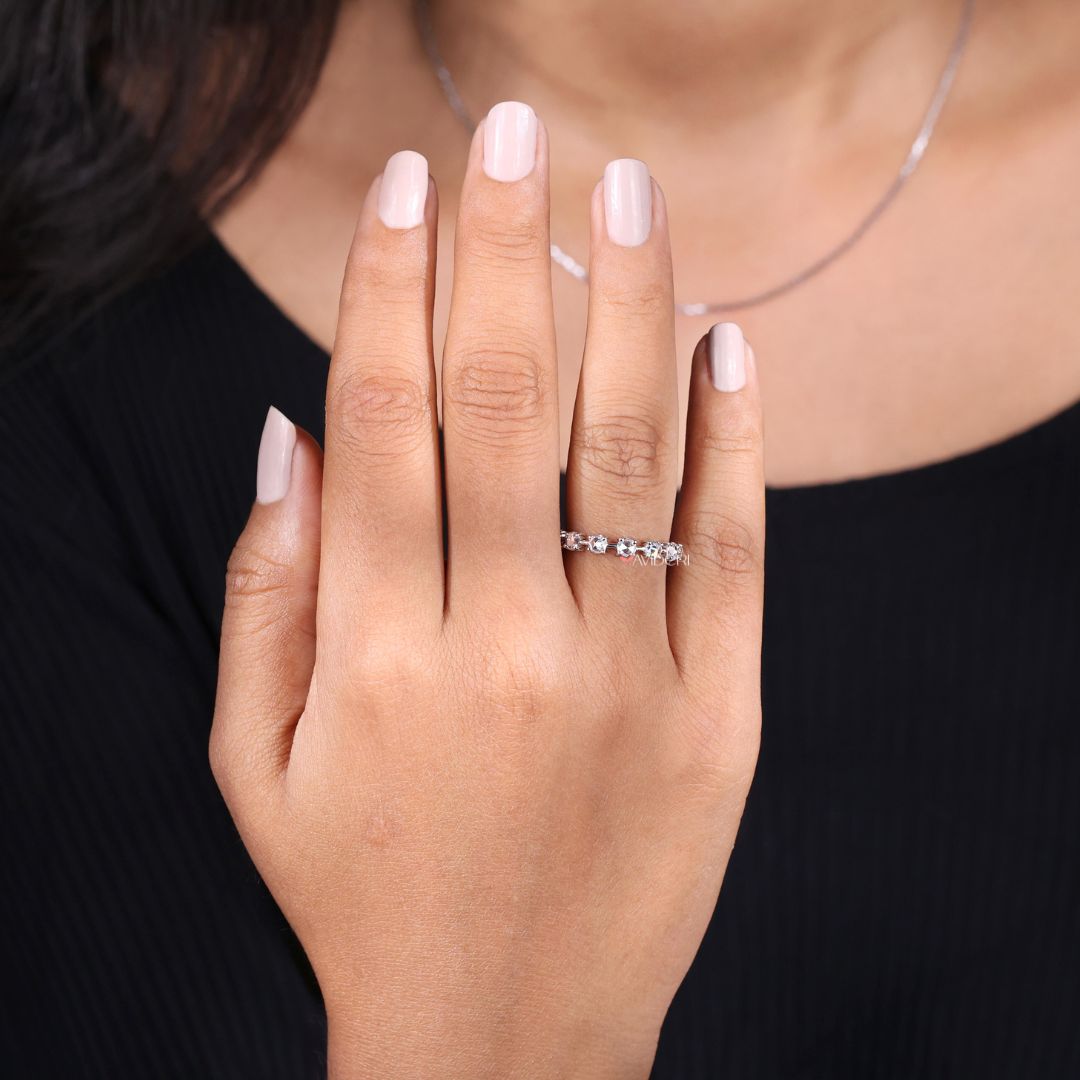 Half eternity wedding band delivers comfort and balance with partial moissanite coverage.
