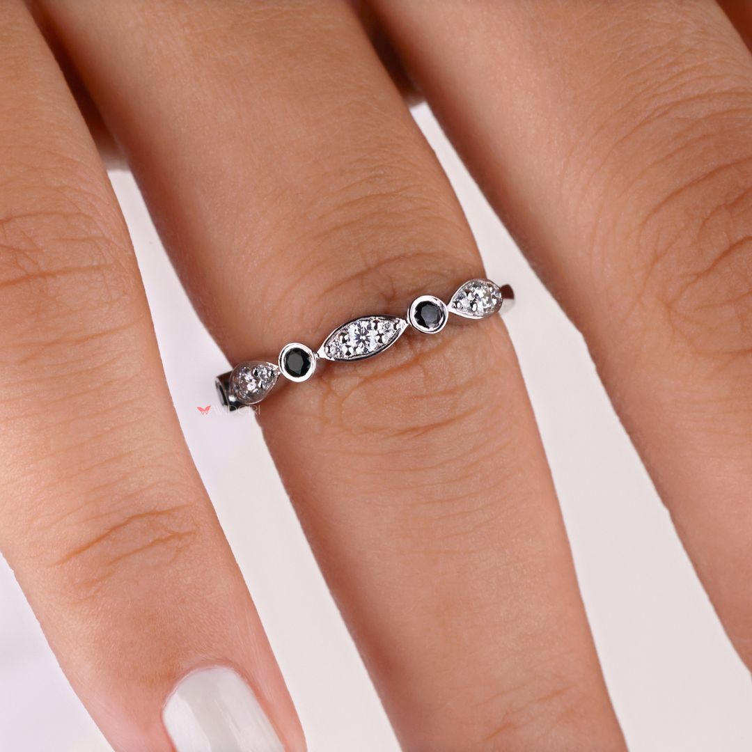 Black round wedding band showcases bold, dark moissanite stones for an edgy, modern look.
