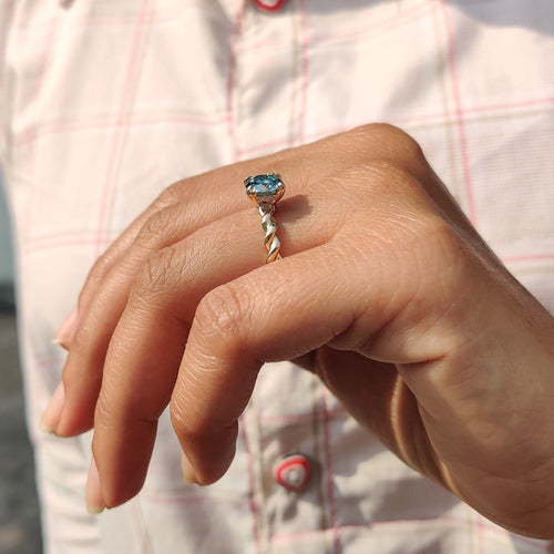 Genevieve Claire - Cyan Blue Round Cut Hidden Halo Ring With Twisted Rope Band