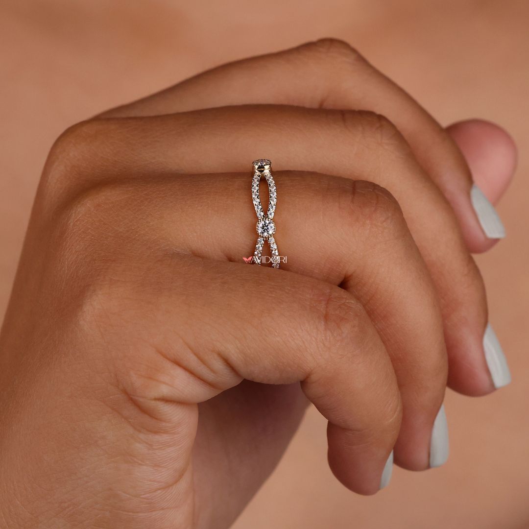 Infinity design band symbolizes eternal love with a continuous loop of sparkling stones.
