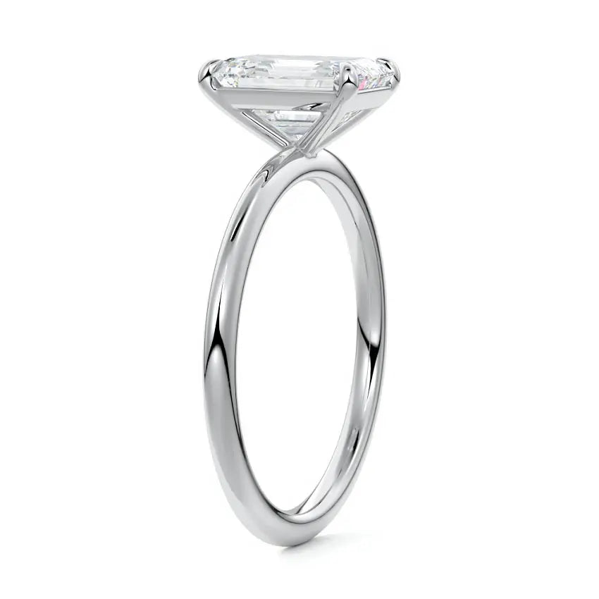 Side profile of emerald cut moissanite ring set in platinum by Nura Lab
