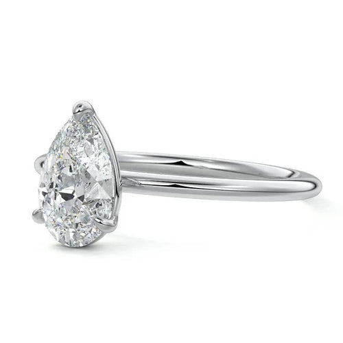 Pear-shaped diamond ring on a white background