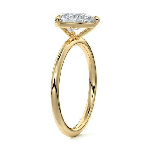 Gold ring with a diamond on a white background