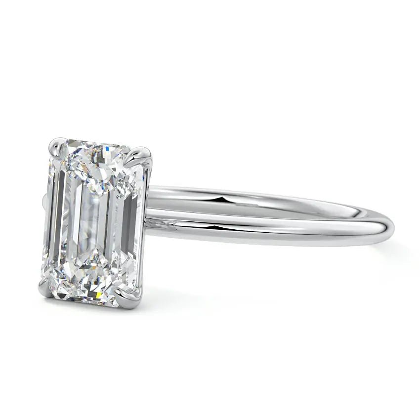 Side profile of emerald cut moissanite ring set in platinum by Nura Lab