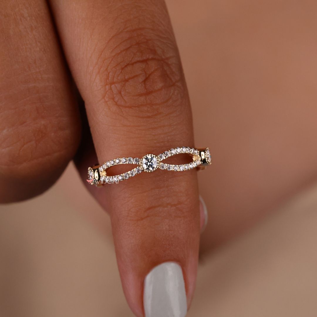 Twisted eternity band offers continuous brilliance in a twisted, full-circle design.
