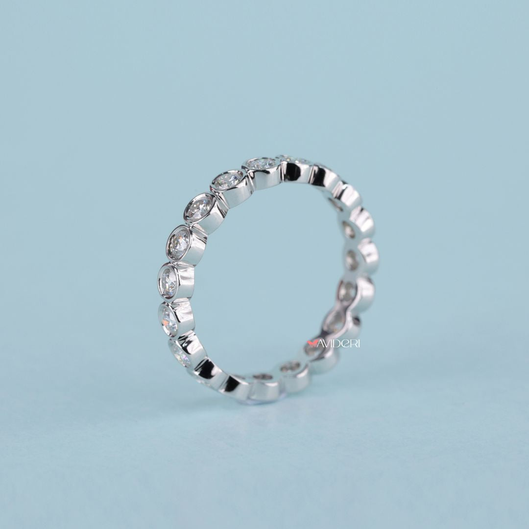 Moissanite wedding band blends bright sparkle with sustainable craftsmanship.
