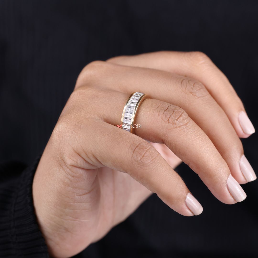 Sleek baguette stones highlight the elegance of a full eternity gold band.
