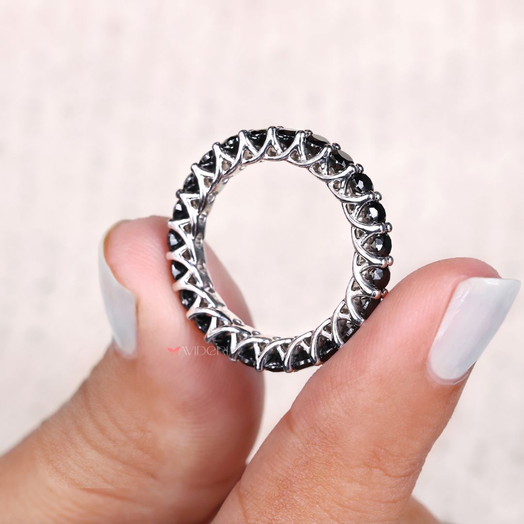 White gold wedding band with a beautiful moissanite eternity band design.
