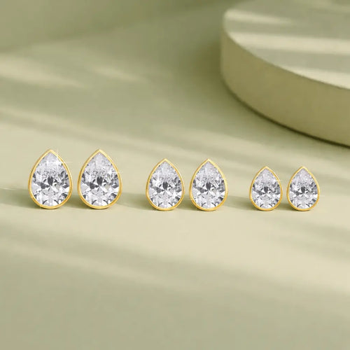 Lucy - Bezel Pear Shape Moissanite Earrings 14K Yellow Gold Nura Lab