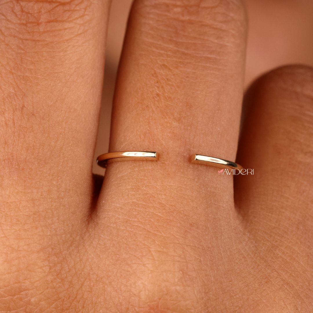 An open gap wedding band offers a sleek, modern style.
