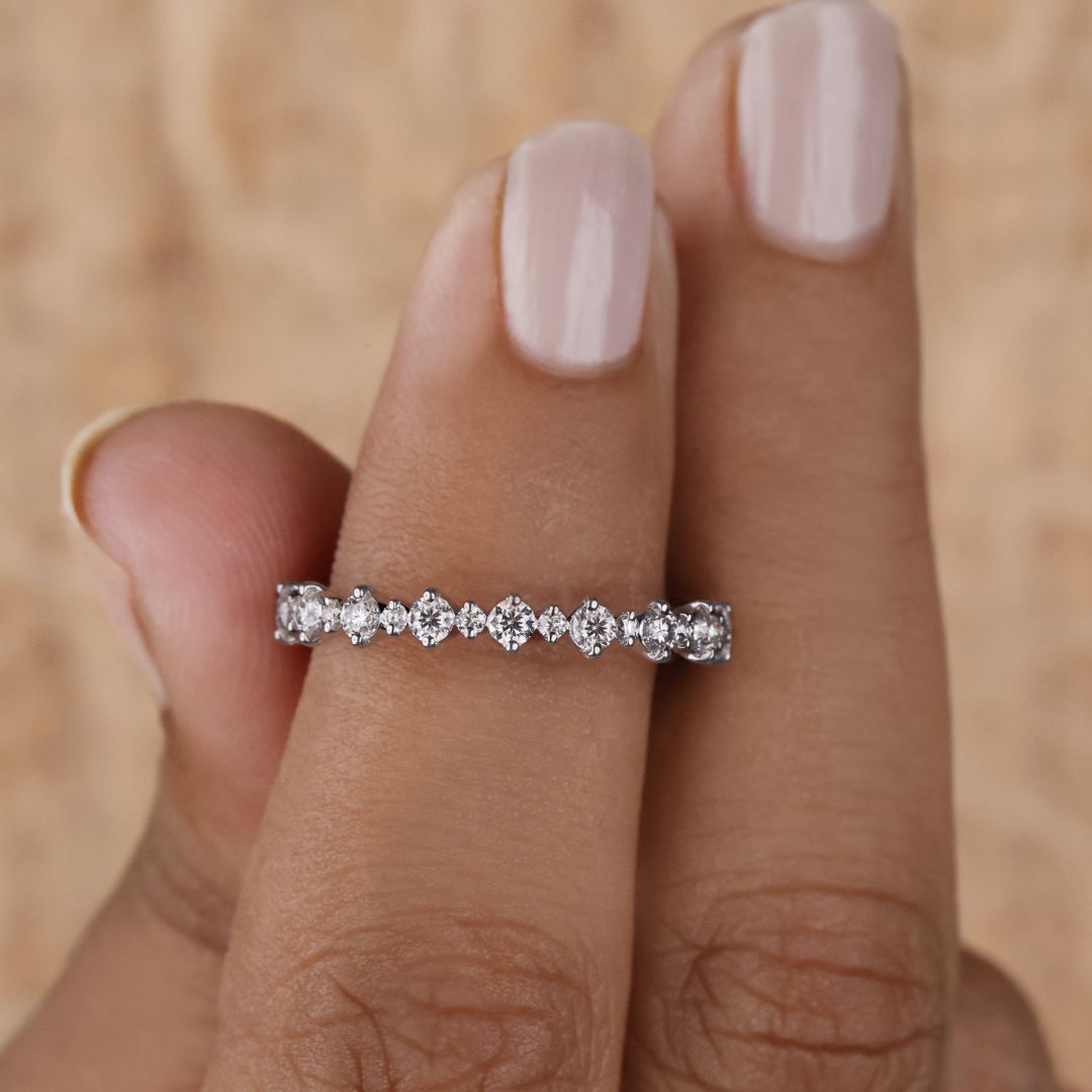 This full eternity band features a sleek round cut moissanite band in a seamless circular design.
