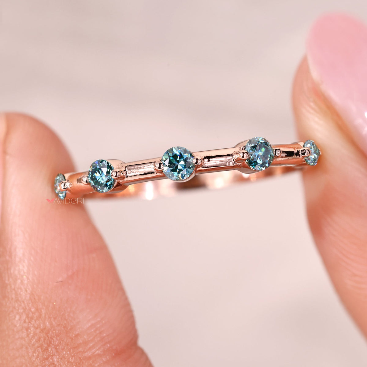 Avideri wedding band combines timeless elegance with contemporary moissanite detailing.