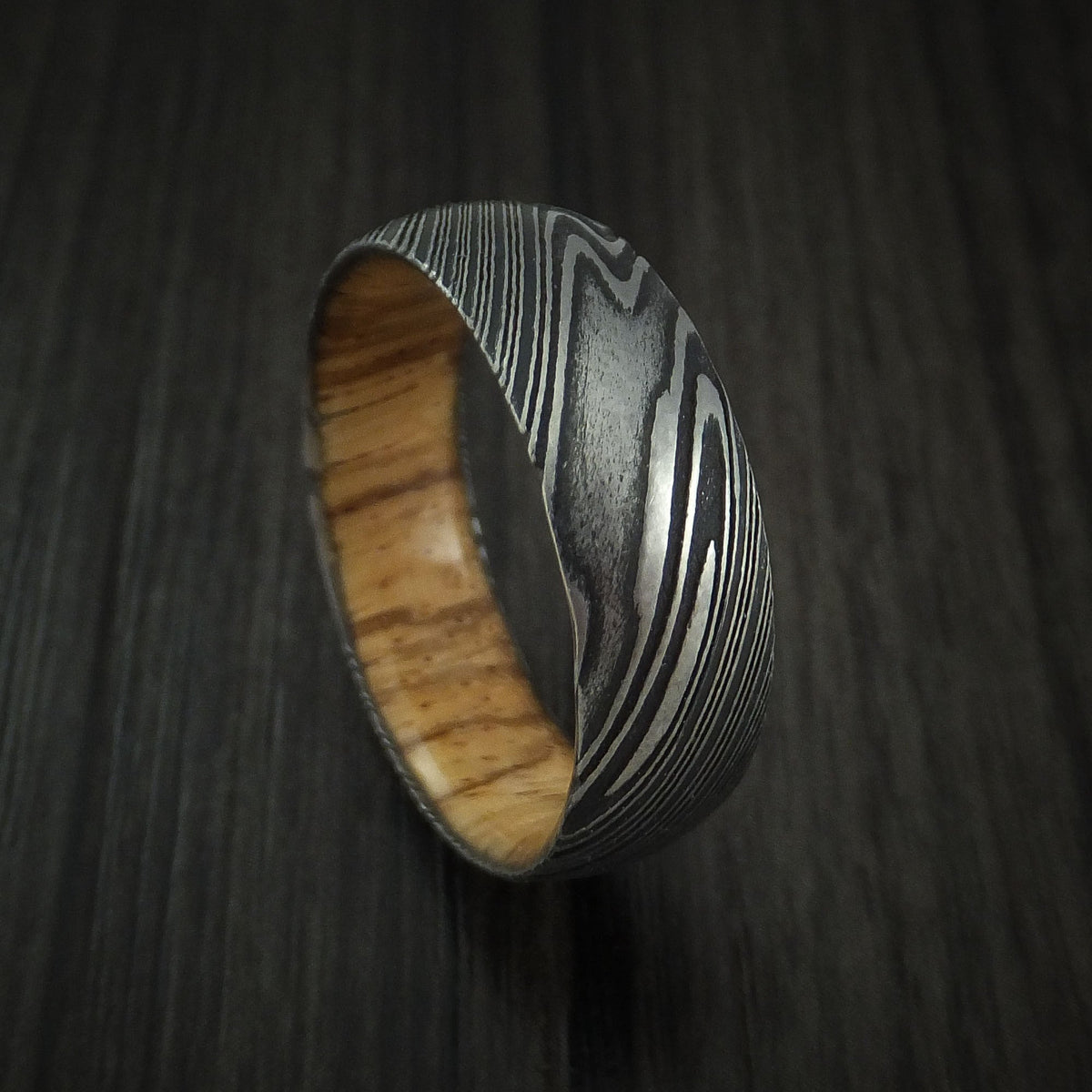 Glacier X - Woodgrain Kuro Damascus Steel Men's Wedding Ring with Zebra Wood Hardwood Sleeve Wood Band - Nura Lab
