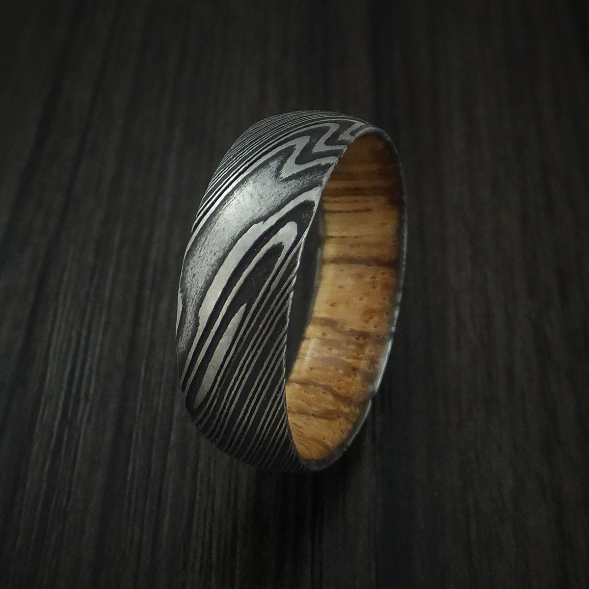 Glacier X - Woodgrain Kuro Damascus Steel Men's Wedding Ring with Zebra Wood Hardwood Sleeve Wood Band - view 4 - Nura Lab