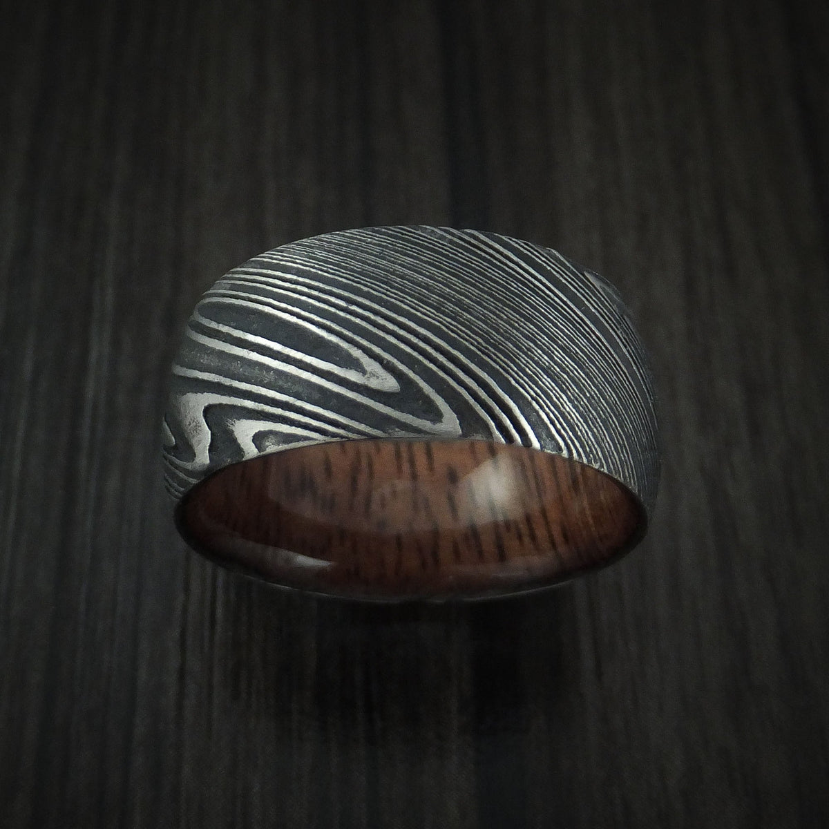 Kingsguard IX - Woodgrain Kuro Damascus Steel Men's Wedding Ring with Koa Wood Hardwood Sleeve Wood Band - view 2 - Nura Lab