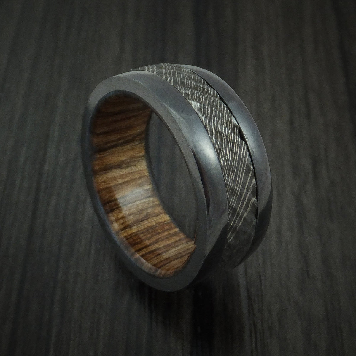 King Arthur XI - Black Zirconium and Damascus Steel Men's Wedding Ring with Tree Bark Carved Finish and Walnut Hardwood Sleeve Band - Nura Lab