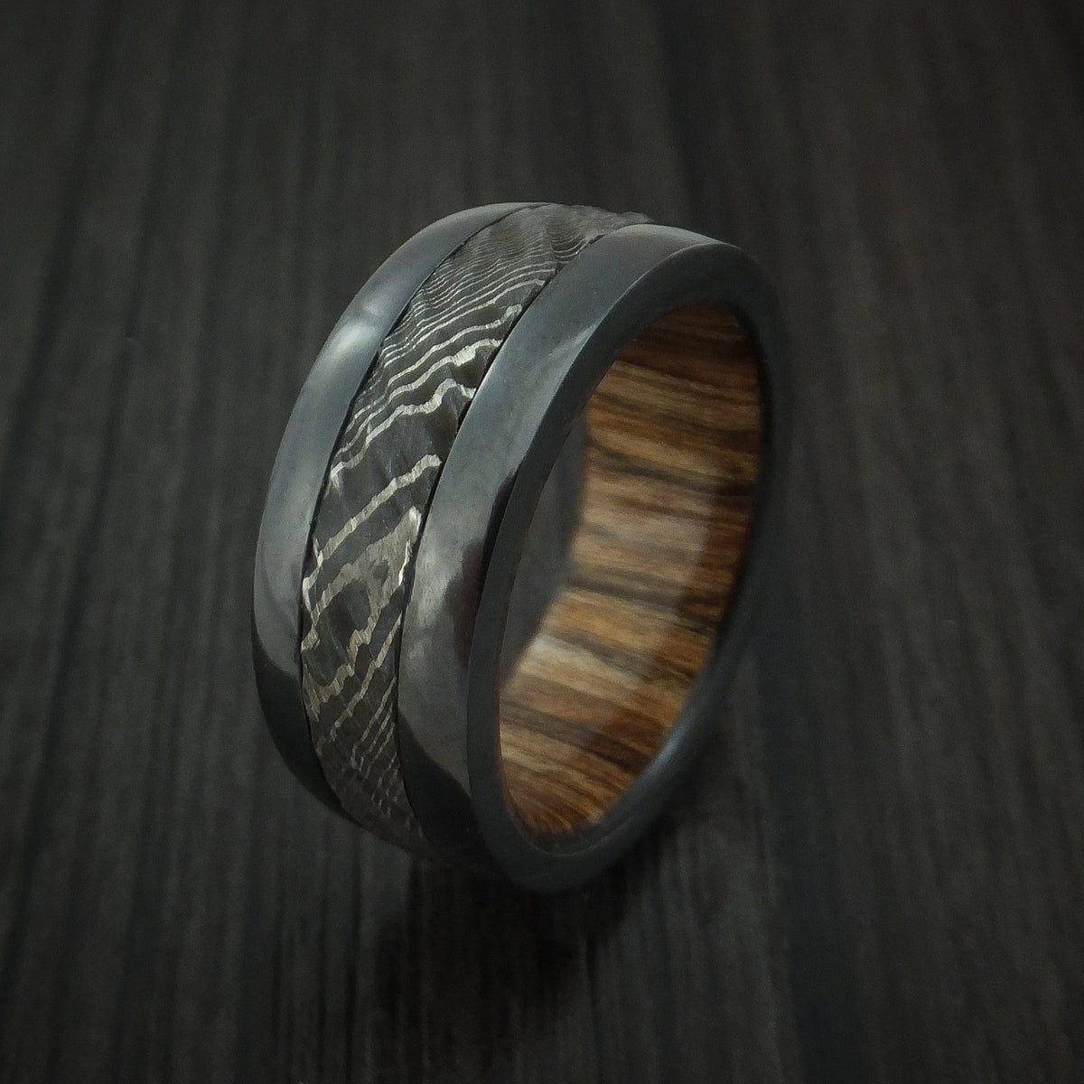 King Arthur XI - Black Zirconium and Damascus Steel Men's Wedding Ring with Tree Bark Carved Finish and Walnut Hardwood Sleeve Band - view 4 - Nura Lab
