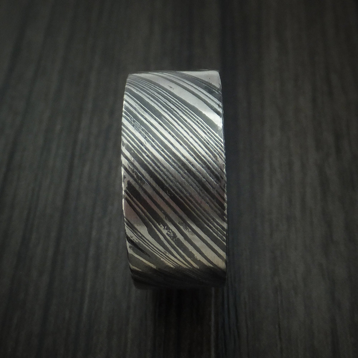 King George XI - Woodgrain Kuro Damascus Steel Men's Wedding Ring with Walnut Wood Hardwood Sleeve Wood Band - view 3 - Nura Lab
