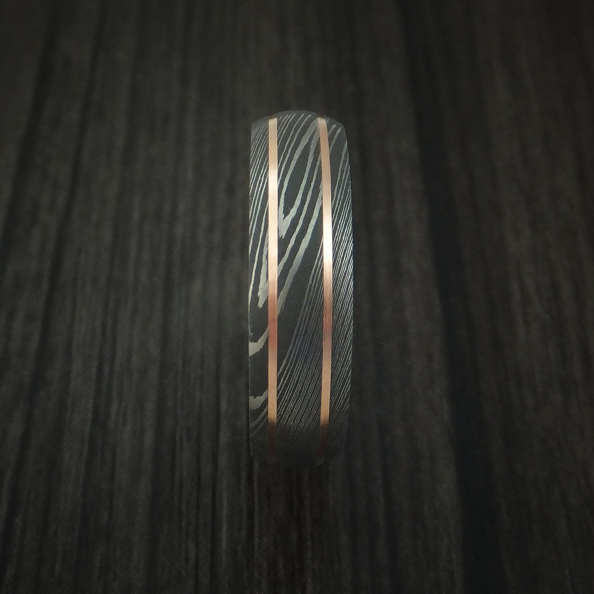 Stonehaven VIII - Damascus Steel and 14K Rose Gold Men's Wedding Ring with Desert Ironwood Burl Sleeve - view 3 - Nura Lab