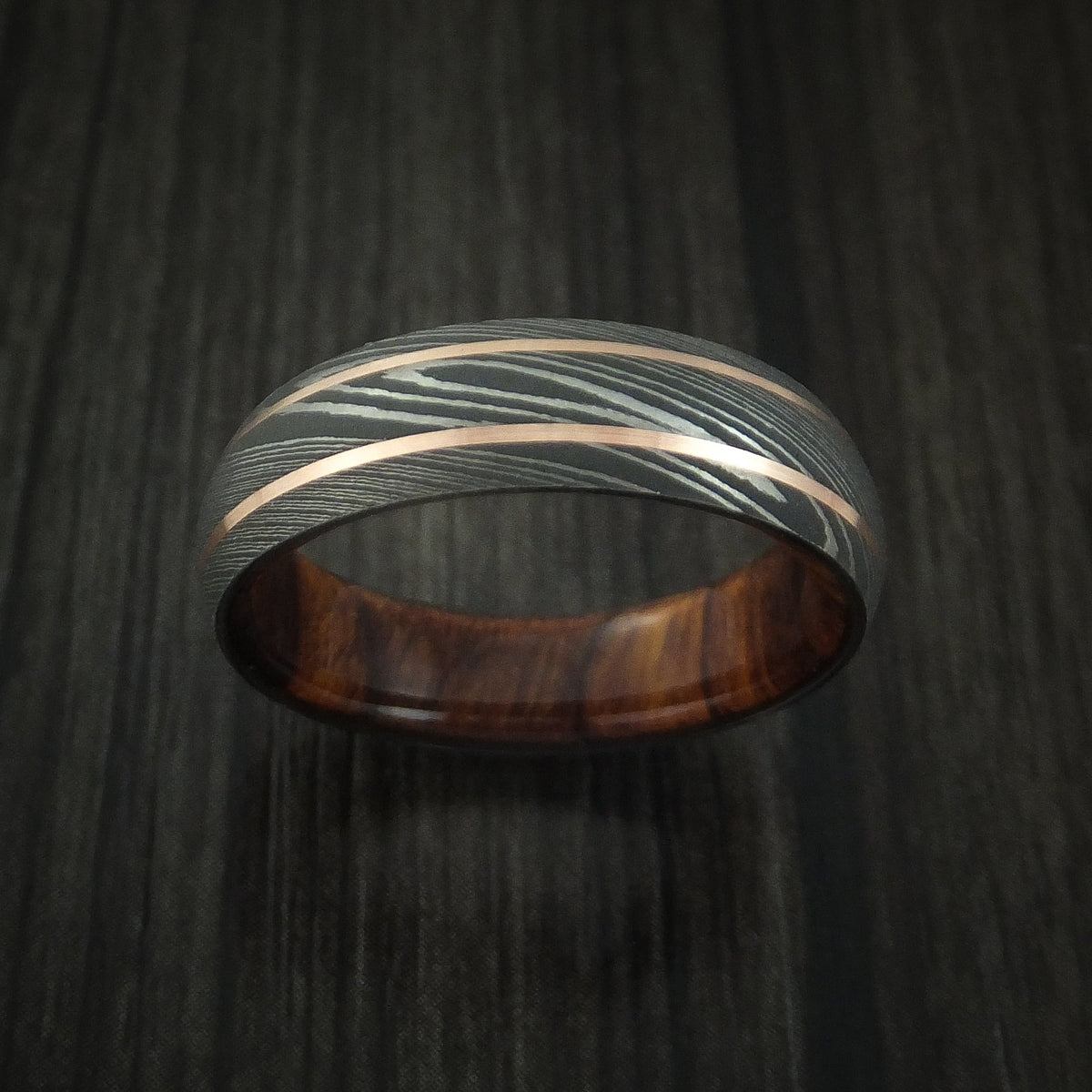 Stonehaven VIII - Damascus Steel and 14K Rose Gold Men's Wedding Ring with Desert Ironwood Burl Sleeve - view 2 - Nura Lab