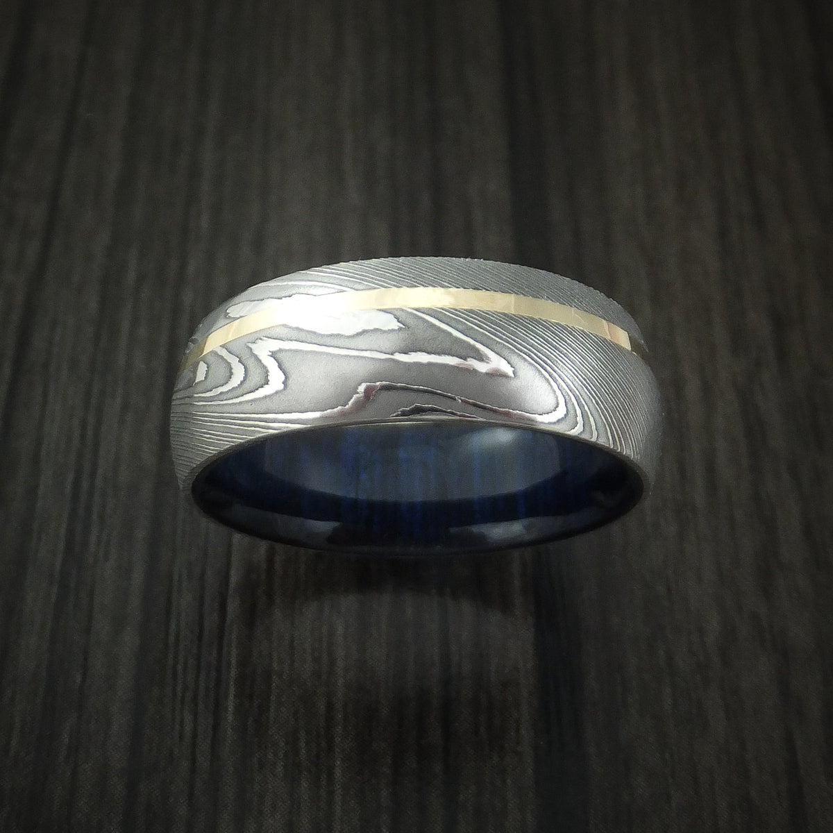 Commander X - Damascus Steel Men's Wedding Ring with 14K Yellow Gold Inlay and Blueberry Wood Hardwood Sleeve Wood Band - view 2 - Nura Lab