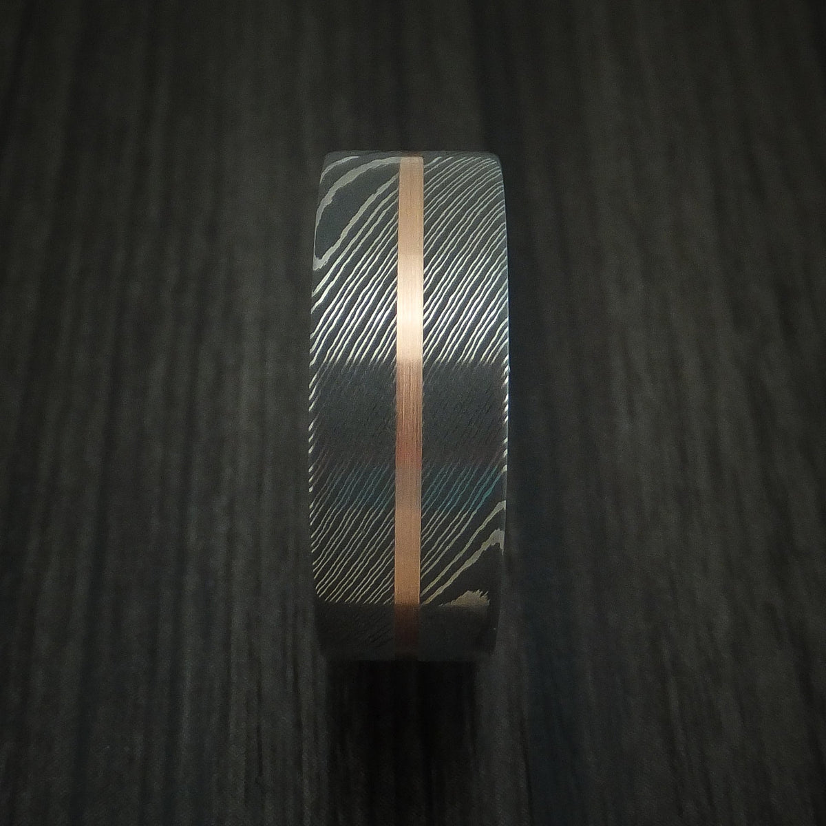Outrider XI - Damascus Steel Men's Wedding Ring with 14k Rose Gold and Teak Hardwood Sleeve - view 3 - Nura Lab