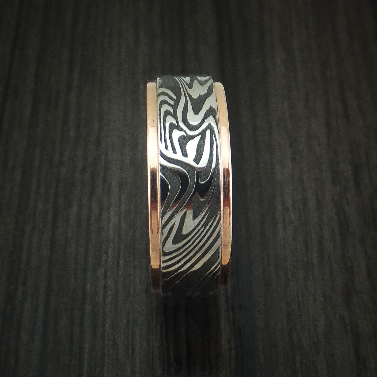 Albatross X - Sunset Kuro Damascus Steel Men's Wedding Ring with 14K Rose Gold Edges Band - view 3 - Nura Lab