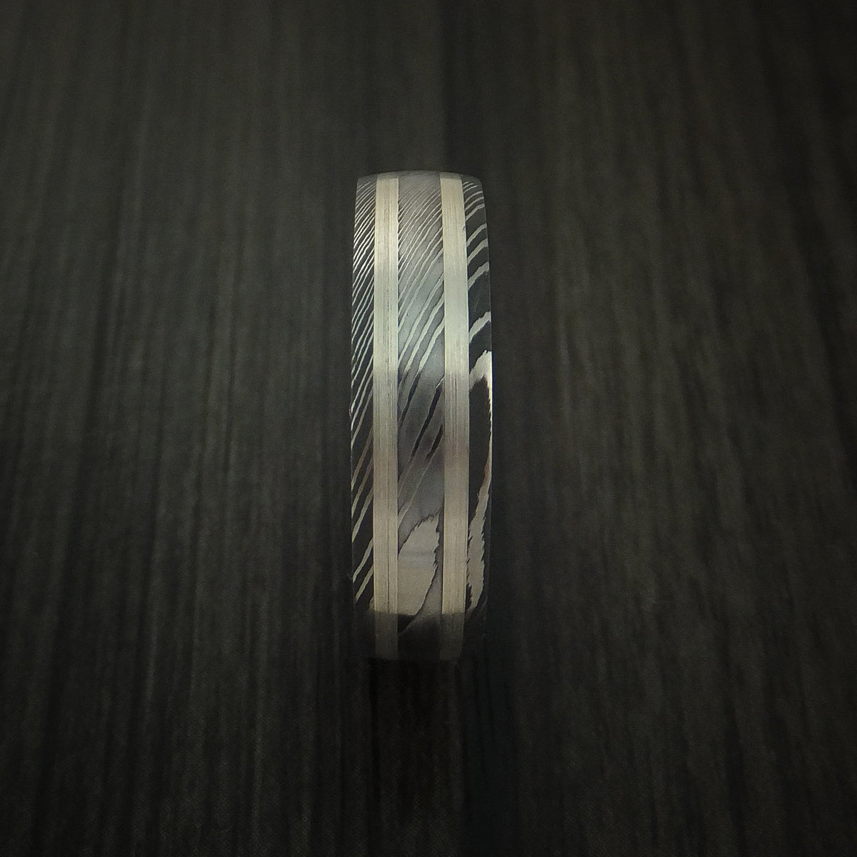 King Henry X - Damascus Steel Men's Wedding Ring with Silver Inlays and Hard Wood Sleeve - view 4 - Nura Lab