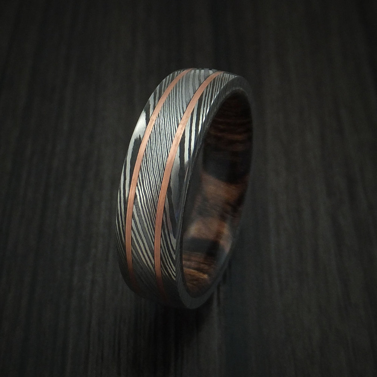 Northwind VIII - Damascus Steel Men's Wedding Ring with 14k Rose Gold Inlays and Hardwood Sleeve - view 4 - Nura Lab