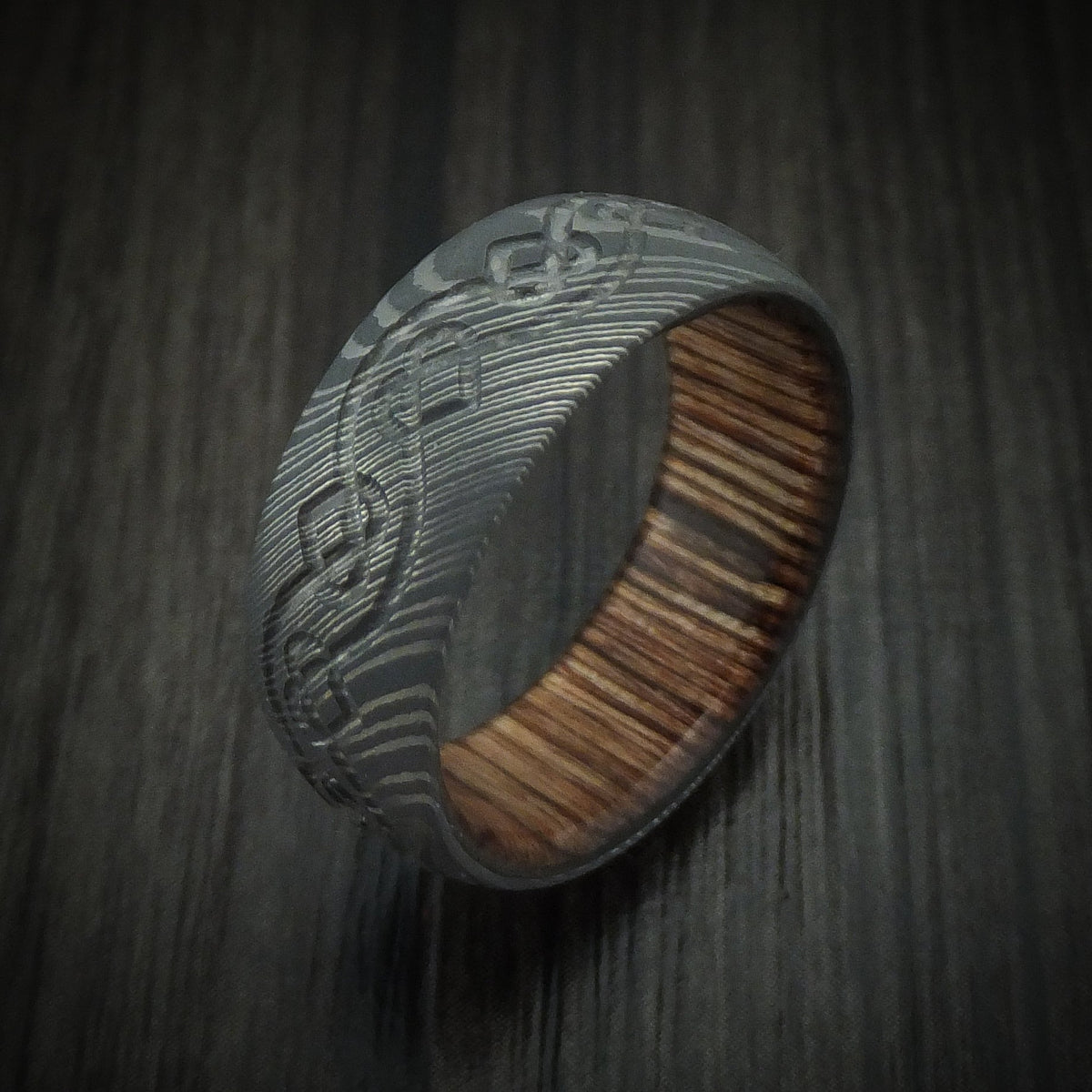 Harbour IX - Damascus Steel Men's Wedding Ring with Milled Celtic Heart Design and Interior Hardwood Sleeve Band - view 4 - Nura Lab