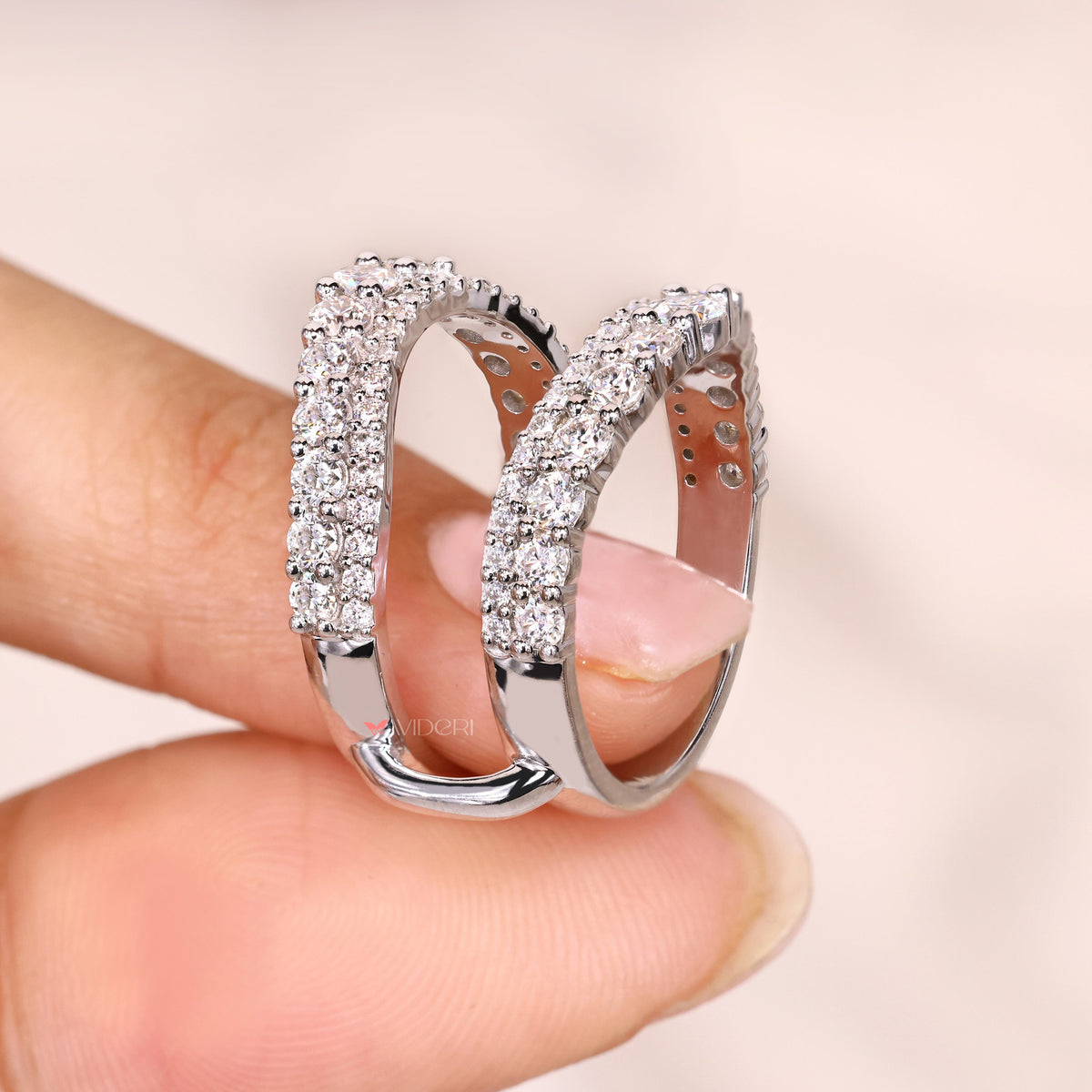 Round moissanite enhancer band with pave set.
