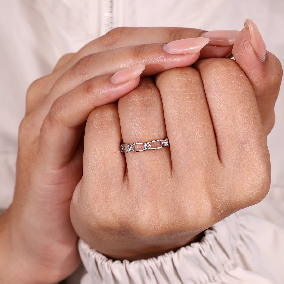 Minimal moissanite eternity band design.
