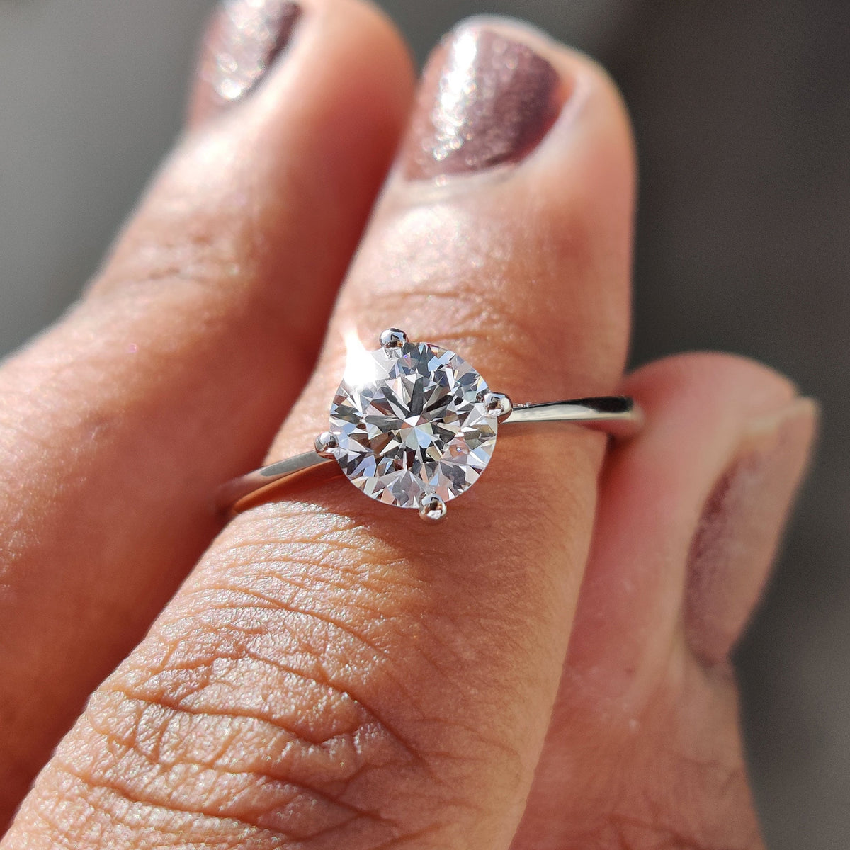 Clarissa Belle - Round Solitaire Engagement Ring With Tapered Shank Design