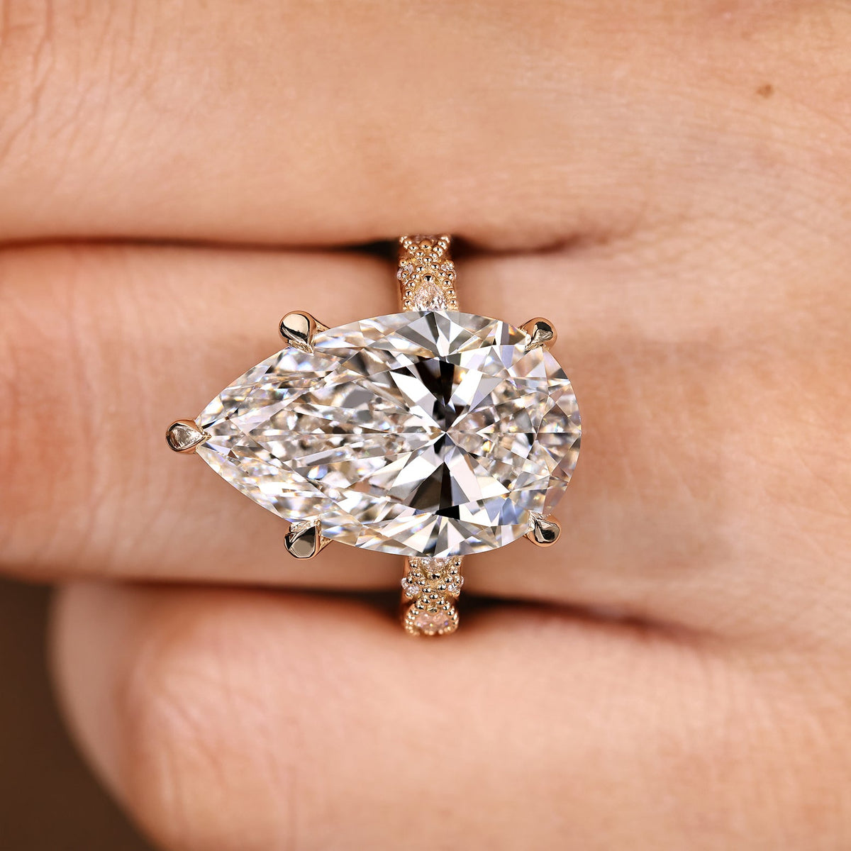 Elodie Grace - 10 Carat Pear Shaped Diamond Ring with Marquise and Round Pave