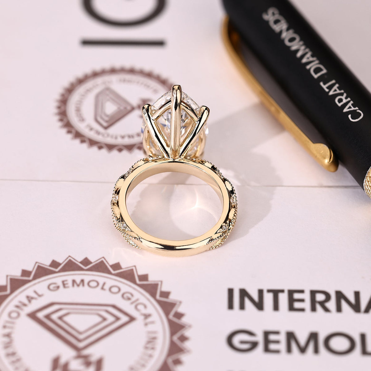 Elodie Grace - 10 Carat Pear Shaped Diamond Ring with Marquise and Round Pave